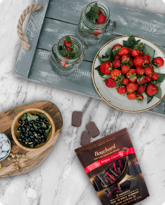Bouchard Dark Chocolate on marble countertop with strawberries
